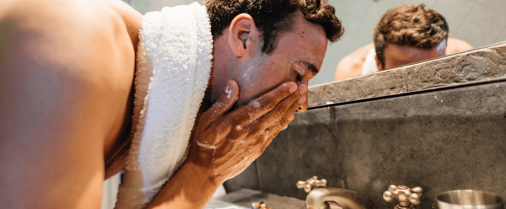 man doing skincare at his home in Marlow